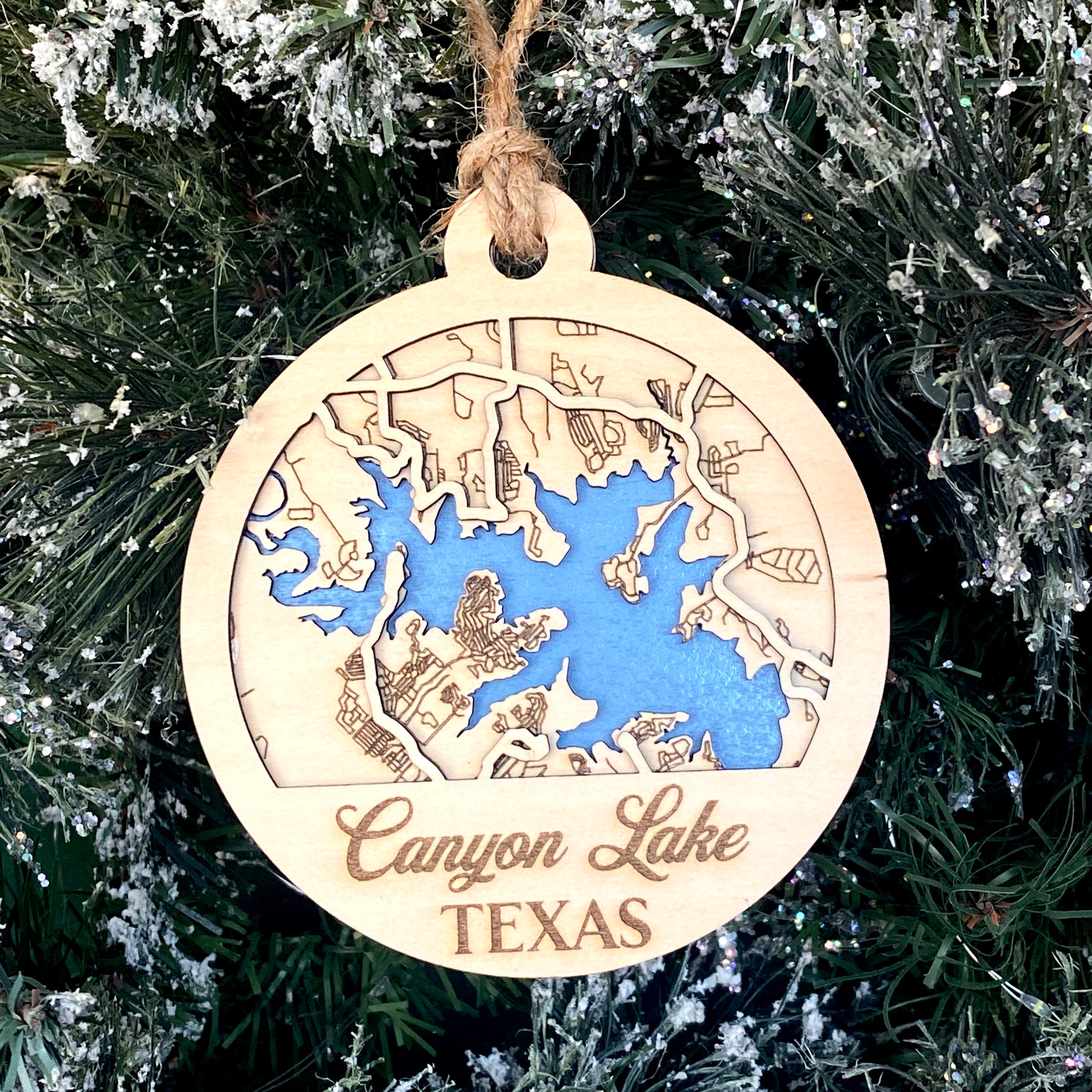 Canyon Lake Map Ornament, featuring a detailed, personalized map design of Canyon Lake. A unique keepsake to commemorate special memories at this scenic location, perfect for adding a personal touch to holiday decor or as a thoughtful gift for visitors and residents.