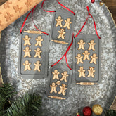 Gingerbread Family Ornament, featuring a charming design of gingerbread figures personalized with family members' names. A festive and sweet keepsake to celebrate family traditions and add a personal touch to your Christmas tree.