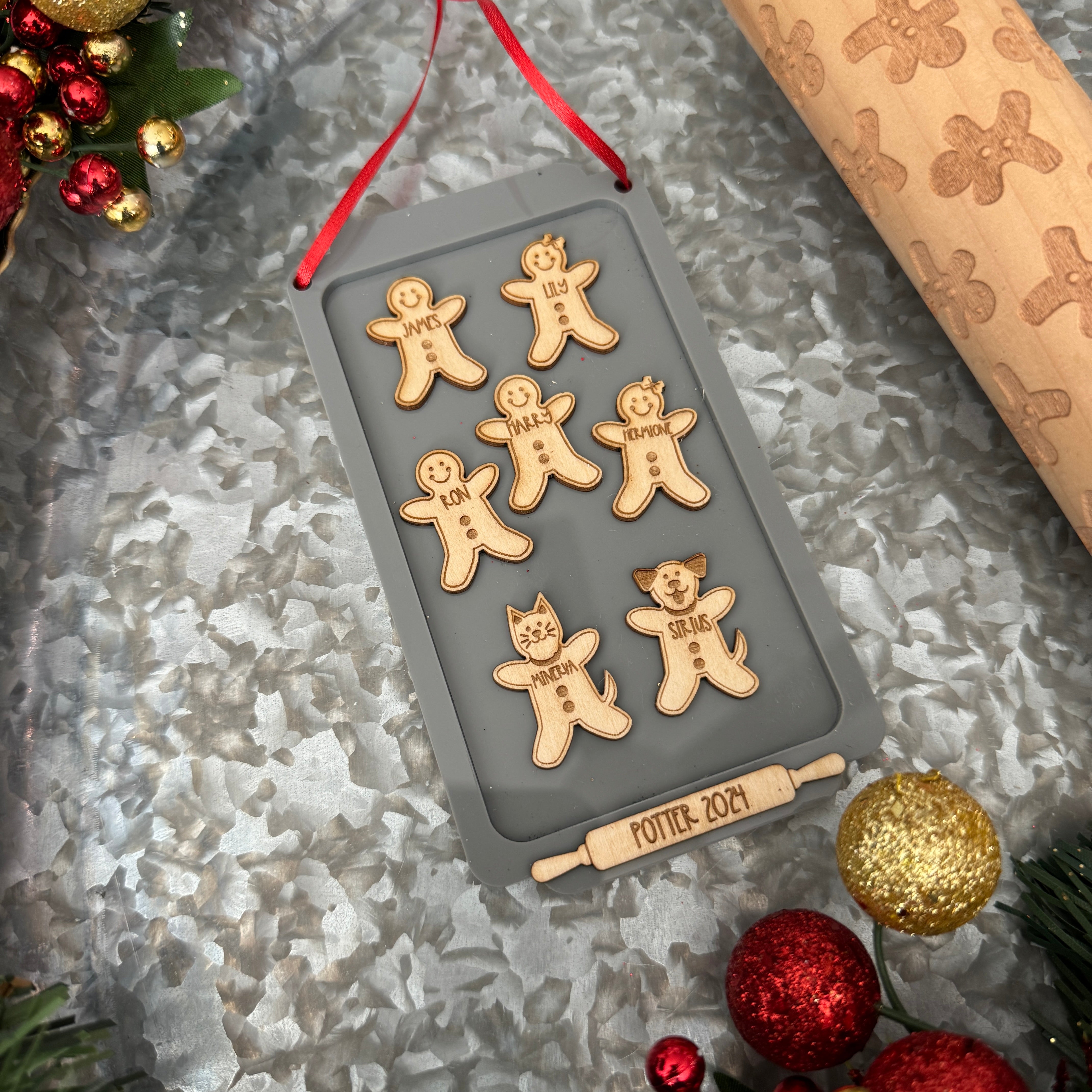 Gingerbread Family Ornament, featuring a charming design of gingerbread figures personalized with family members' names. A festive and sweet keepsake to celebrate family traditions and add a personal touch to your Christmas tree.