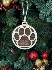 Ornament for Dog Lovers, featuring "Puppy's First Christmas" or a Pet Memorial design, shaped like a paw and personalized with your pet's name. A heartfelt keepsake to celebrate a new puppy’s first holiday or honor a cherished pet, adding a special and personalized touch to your Christmas tree.
