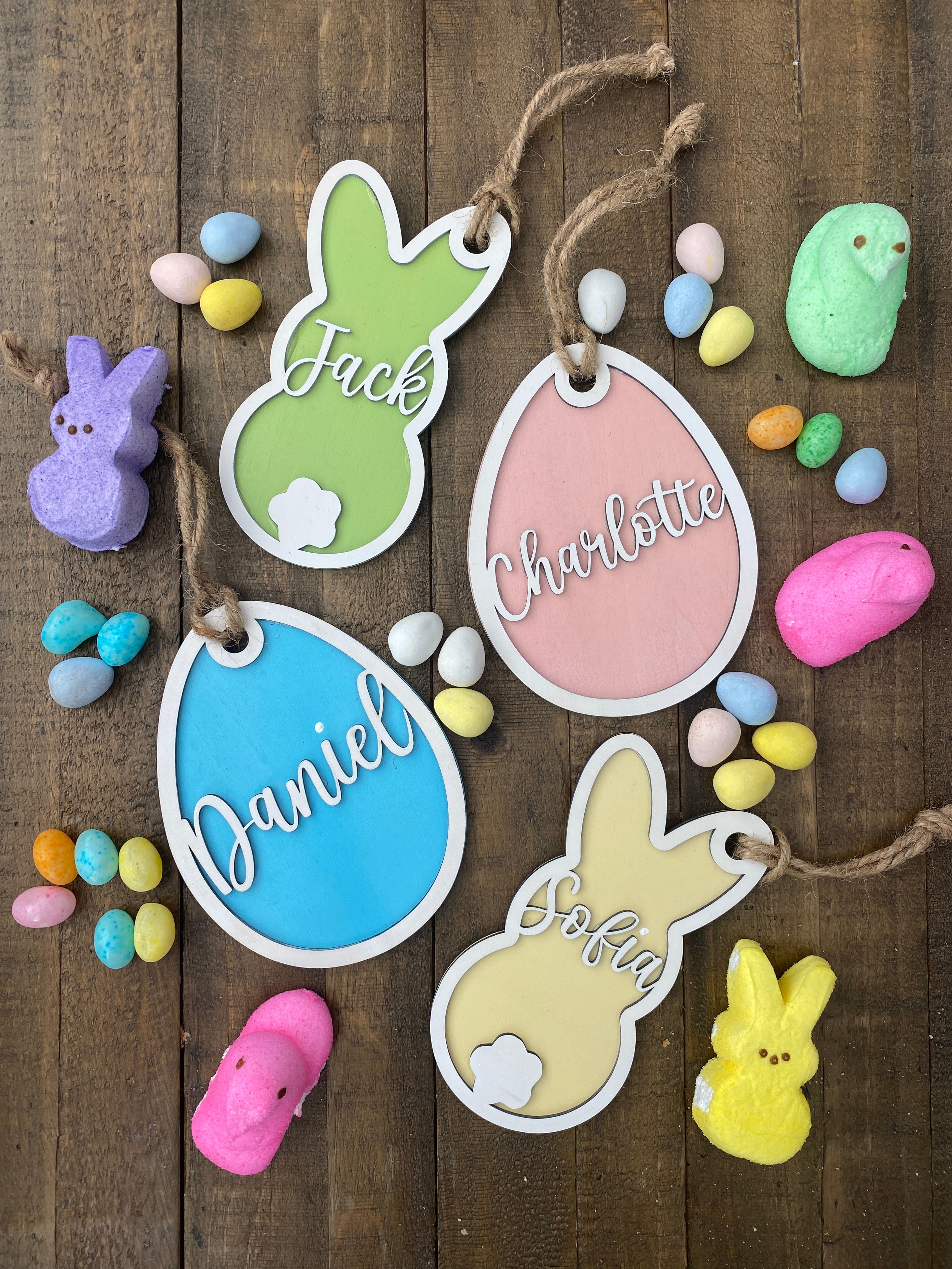 Personalized Wood Easter Basket Tags in a variety of shapes and colors, perfect for adding a unique and festive touch to Easter baskets. These custom tags can be personalized with names or special messages, making them a great addition to your Easter celebrations or as thoughtful gifts.