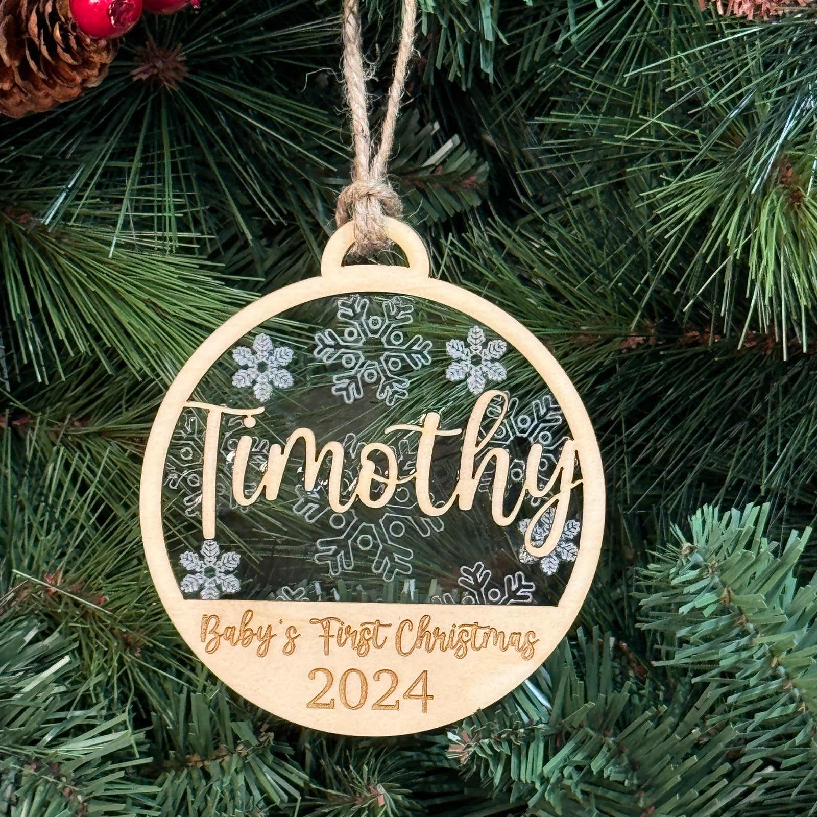 Baby's First Christmas Ornament with multiple design options, personalized with baby’s name, year, and 'Baby’s First Christmas' text. A charming keepsake to celebrate a newborn’s first holiday season, offering a variety of designs to suit every style. Perfect for adding a special touch to Christmas trees and holiday decor.