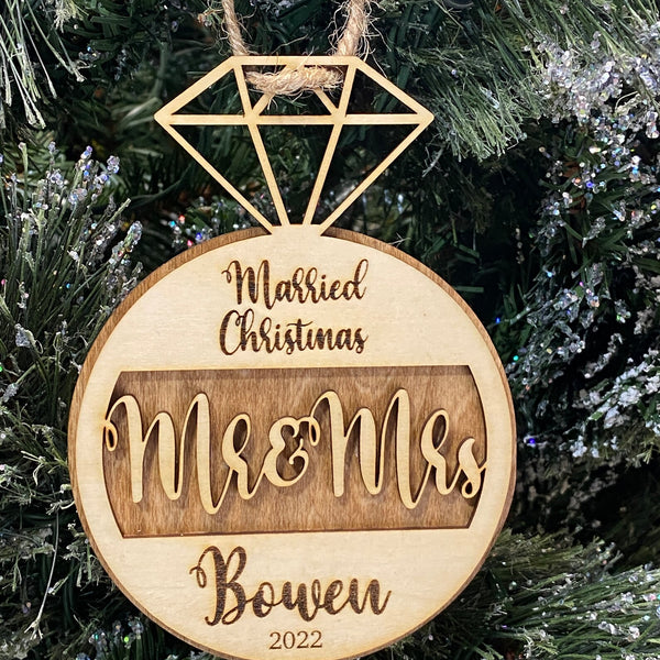Newlywed Couple Gift, a personalized Just Married Christmas Ornament, perfect for celebrating the first holiday season together. An ideal wedding or bridal shower gift, this keepsake adds a special touch to the couple's Christmas tree and commemorates their new life together.