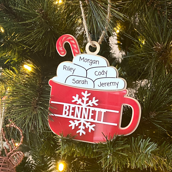 Hot Cocoa Mug Family Ornament, featuring a cozy design with personalized details for each family member. Perfect for celebrating family holiday traditions, this charming ornament adds a warm, festive touch to your Christmas tree and makes a thoughtful gift for loved ones.