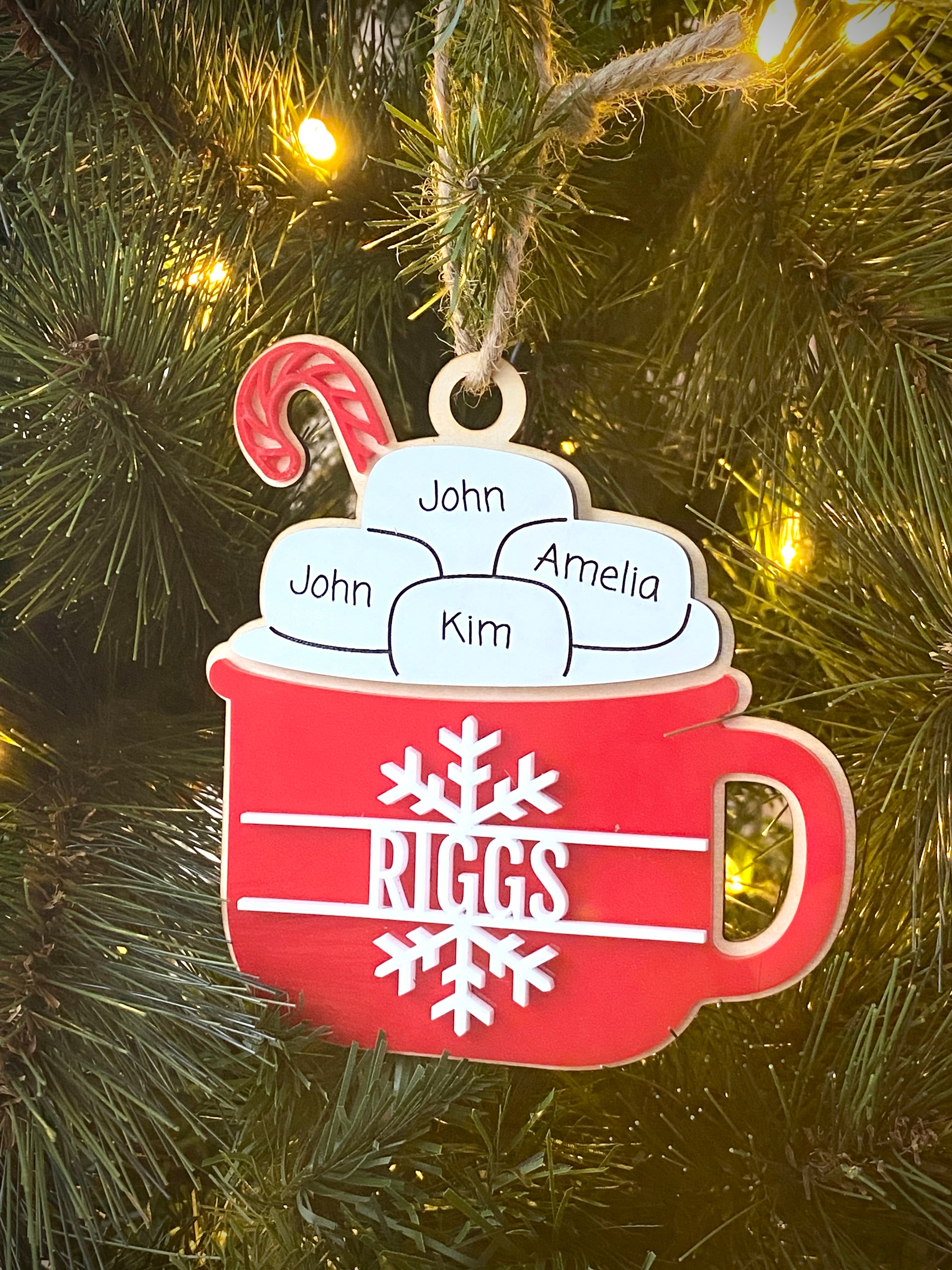 Hot Cocoa Mug Family Ornament, featuring a cozy design with personalized details for each family member. Perfect for celebrating family holiday traditions, this charming ornament adds a warm, festive touch to your Christmas tree and makes a thoughtful gift for loved ones.