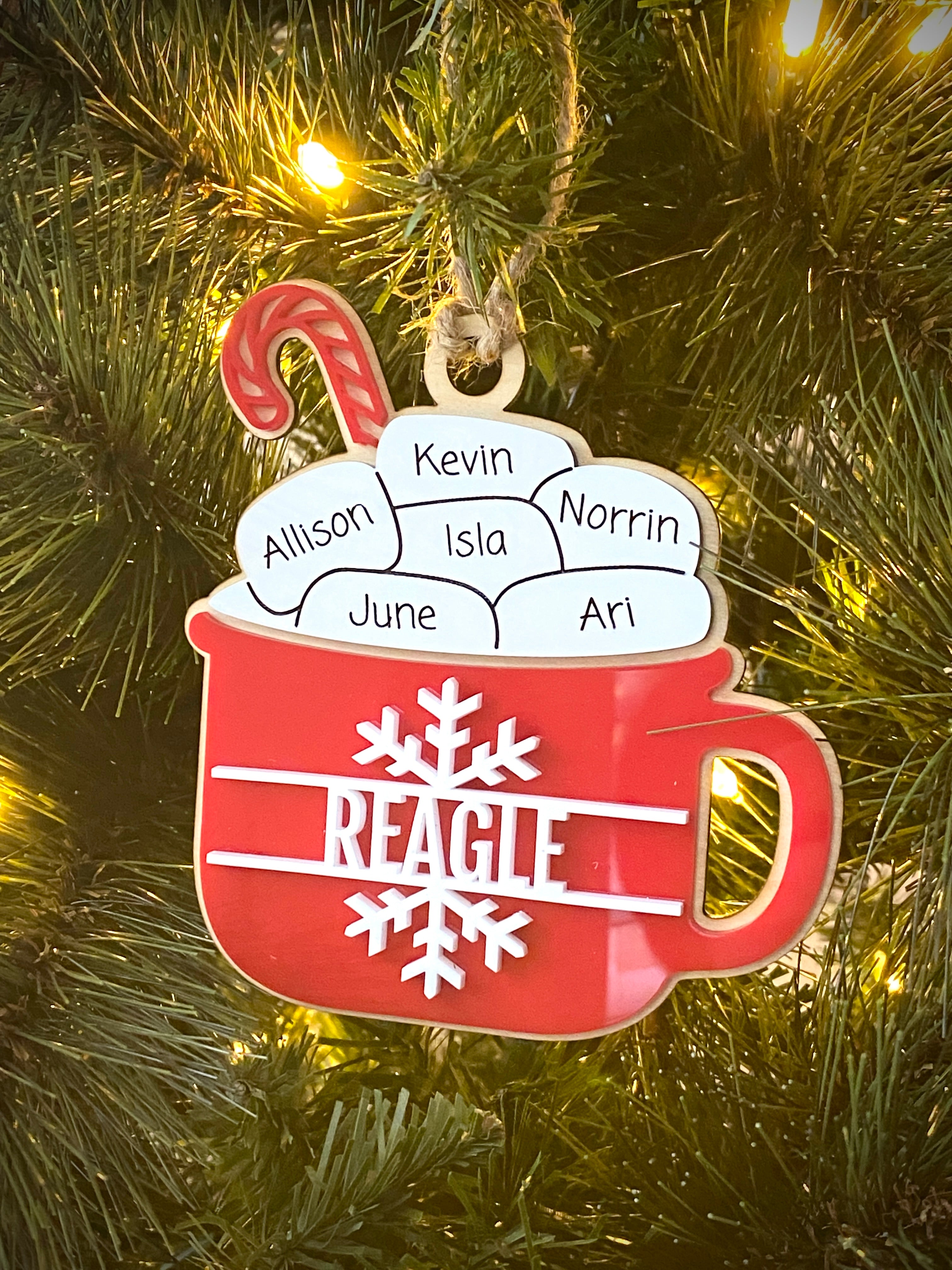 Hot Cocoa Mug Family Ornament, featuring a cozy design with personalized details for each family member. Perfect for celebrating family holiday traditions, this charming ornament adds a warm, festive touch to your Christmas tree and makes a thoughtful gift for loved ones.