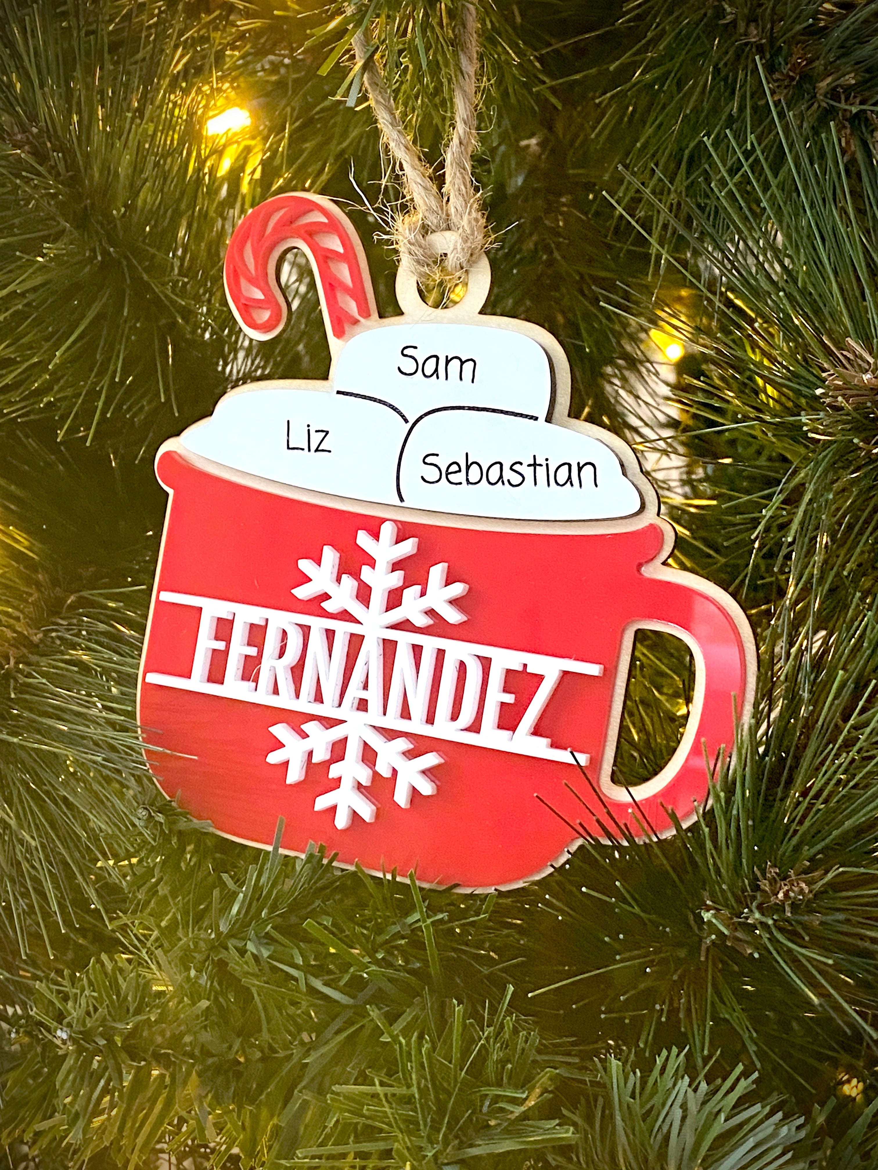 Hot Cocoa Mug Family Ornament, featuring a cozy design with personalized details for each family member. Perfect for celebrating family holiday traditions, this charming ornament adds a warm, festive touch to your Christmas tree and makes a thoughtful gift for loved ones.
